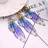 Boucles d'oreille ailes de fée, ailes de papillons bleues violettes et strass - BIJOUX - THE FASHION PARADOX