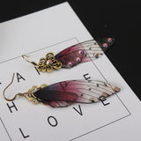 Boucles d'oreille ailes de fée, ailes de papillons bordeaux et strass - BIJOUX - THE FASHION PARADOX