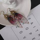 Boucles d'oreille ailes de fée, ailes de papillons bordeaux et strass - BIJOUX - THE FASHION PARADOX