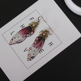 Boucles d'oreille ailes de fée, ailes de papillons bordeaux et strass - BIJOUX - THE FASHION PARADOX
