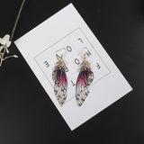 Boucles d'oreille ailes de fée, ailes de papillons bordeaux et strass - BIJOUX - THE FASHION PARADOX