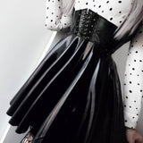 Jupe patineuse noire en simili cuir vegan ceinture serre taille - Jupes - THE FASHION PARADOX