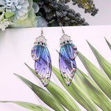 Boucles d'oreille ailes de fée, ailes de papillons bleues violettes et strass - BIJOUX - THE FASHION PARADOX