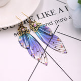 Boucles d'oreille ailes de fée, ailes de papillons bleues violettes et strass - BIJOUX - THE FASHION PARADOX